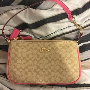 Brand new coach bag. Pink & tan ! No tags but never used!